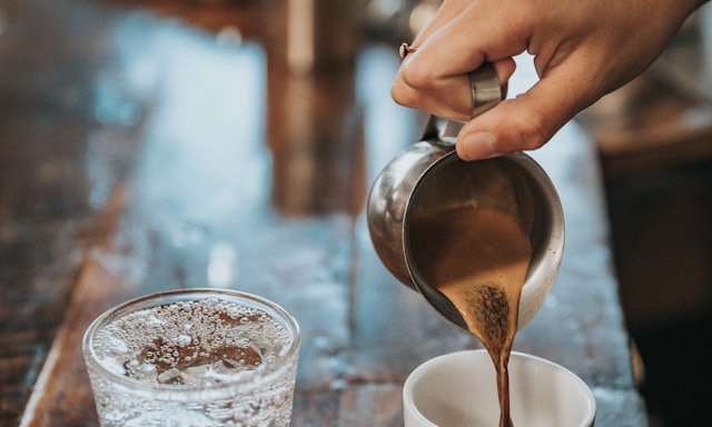 Pouring hot water over a pour over coffee dripper