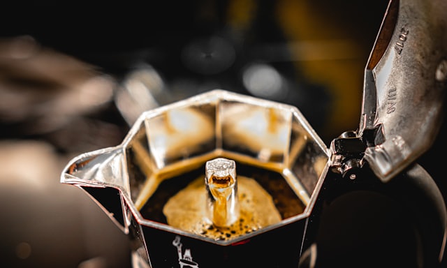 Coffee brewing up into the top chamber of a moka pot